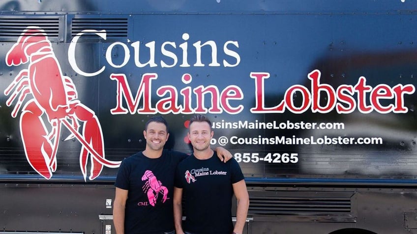 two men in front of Cousins Maine Lobster