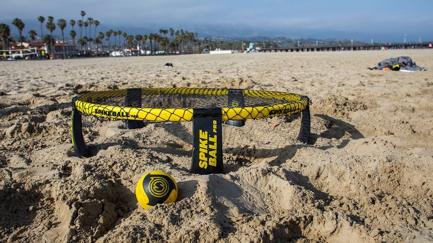 Spikeball game on the beach