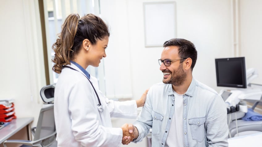 Female doctor with male patient