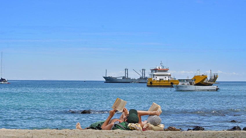 A couple reading at the beach