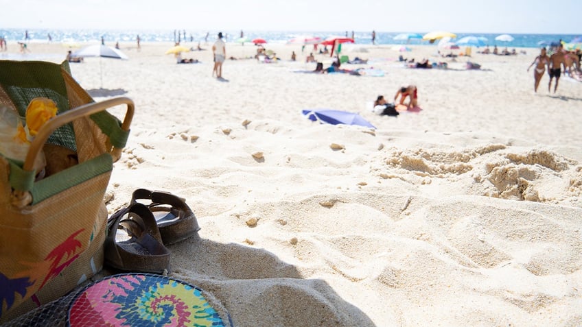 A beach bag on the sand