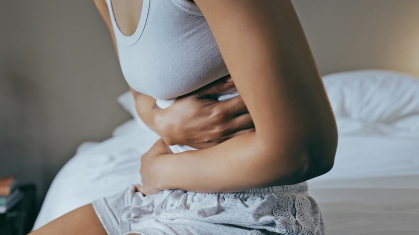 A woman with stomach pain