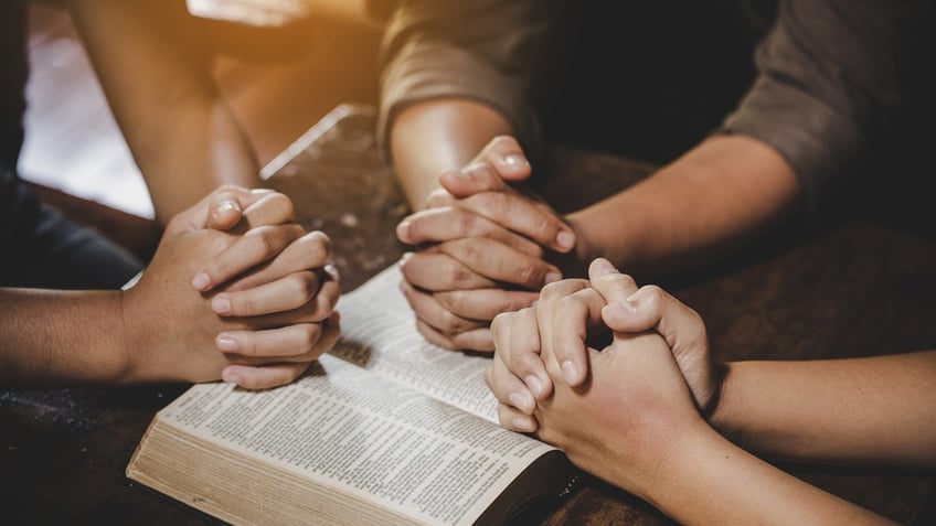 people praying together