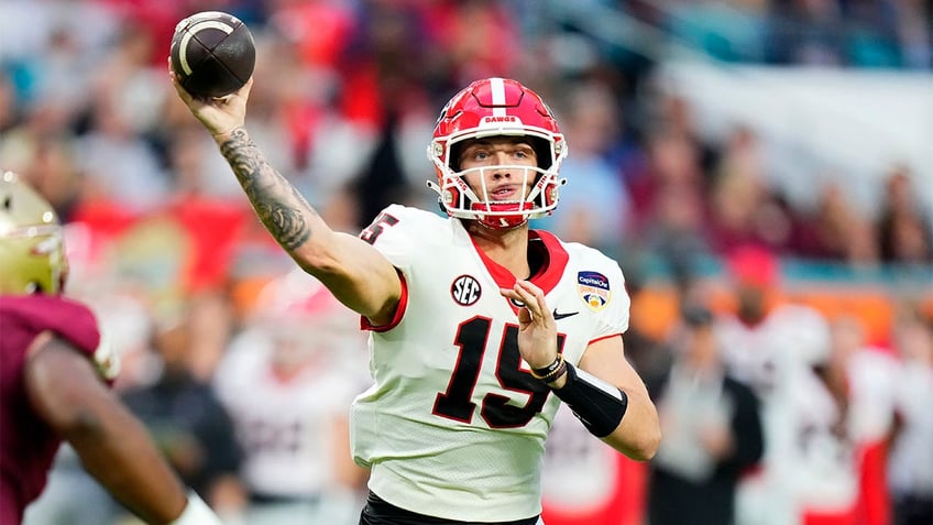 Carson Beck passes in the Orange Bowl