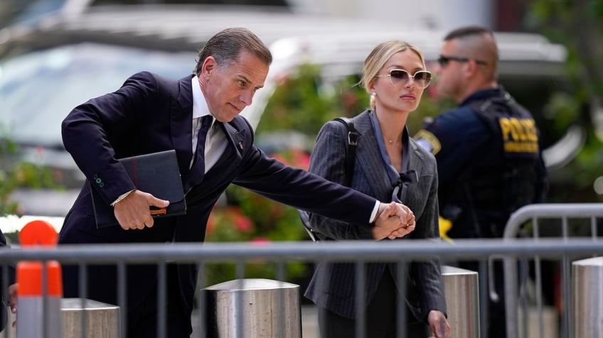 Hunter Biden and his wife, Melissa Cohen Biden, arrives at federal court