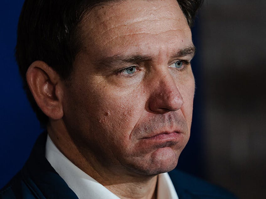 Ron DeSantis, governor of Florida and 2024 Republican presidential candidate, speaks to members of the media after a Manchester Liberty Town Hall event at The Factory in Manchester, New Hampshire, US, on Saturday, Dec. 30, 2023. Two new super PACs allied with DeSantis booked more than $8 million in advertisements …