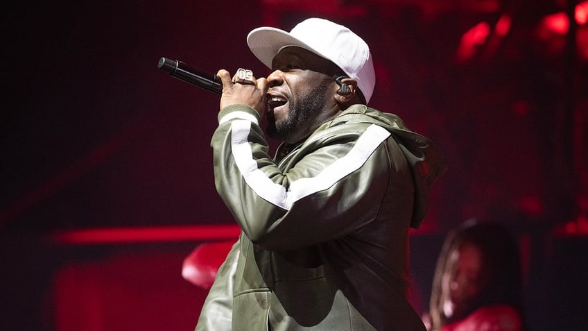 50 cent throws microphone into audience allegedly injuring concertgoer