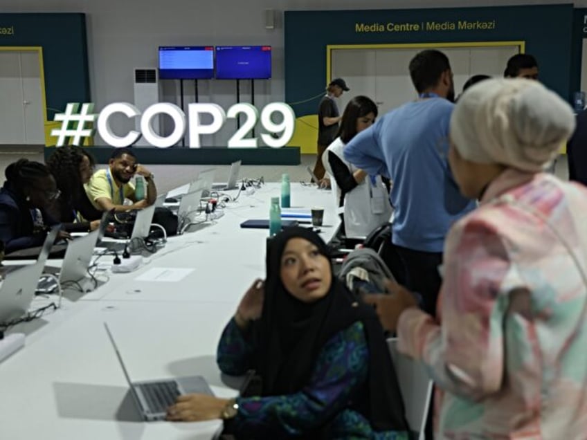 BAKU, AZERBAIJAN - NOVEMBER 10: Participants sit at the conference venue prior to the UNFC