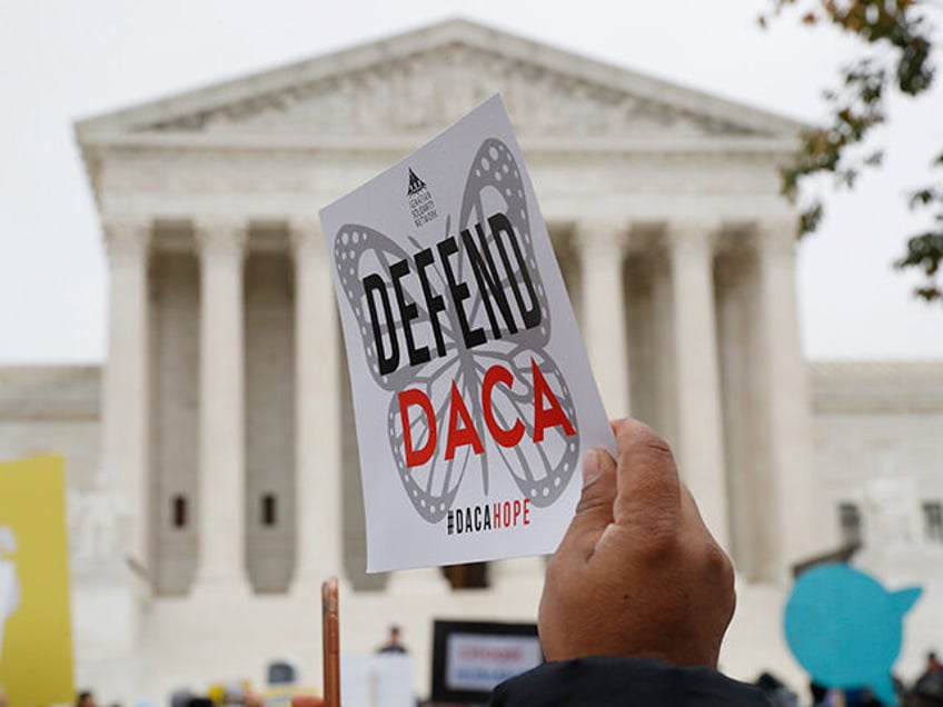 People rally outside the Supreme Court over President Trump's decision to end the Deferred