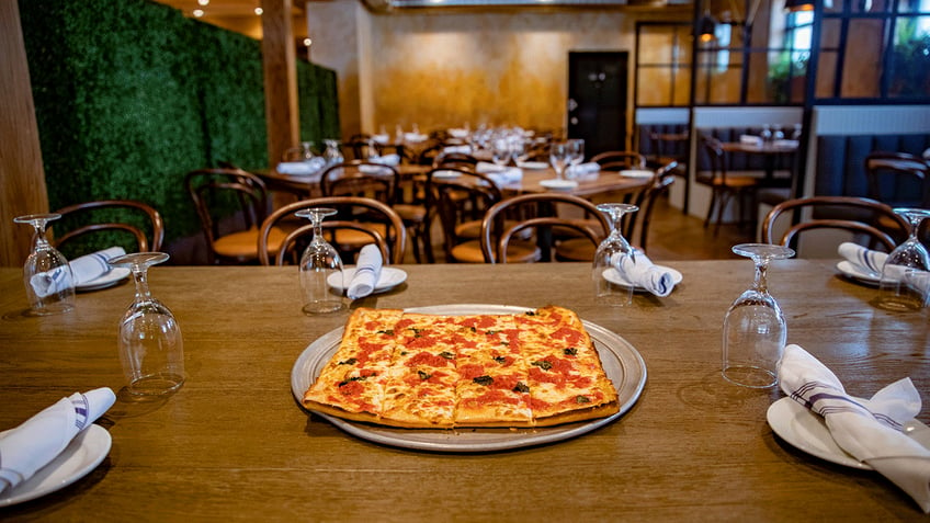 A Grandma pizza pie on a table