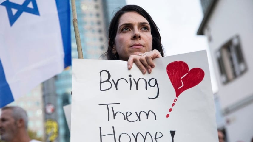 Woman holding sign