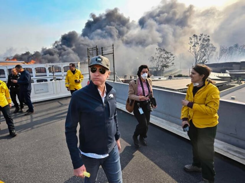PCIFIC PALISADES, CA - January 08: California Governor Gavin Newsom surveys damage in duri