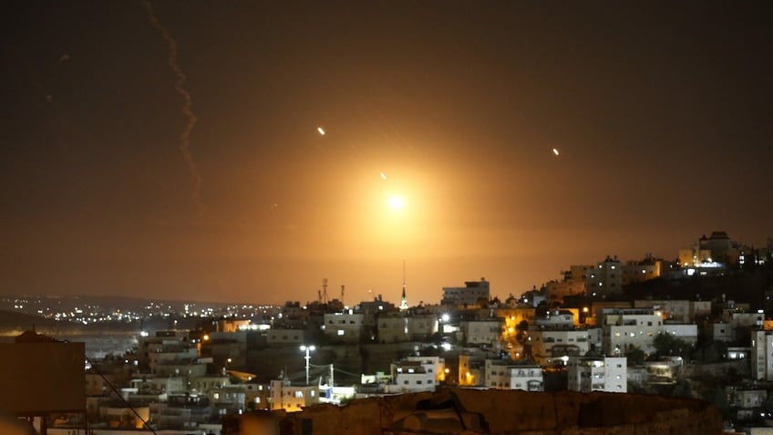 Many rockets, fired from Iran, are seen over Jerusalem from Hebron, West Bank on October 1, 2024. The Israeli army announced that missiles were fired from Iran towards Israel and sirens were heard across the country, especially in Tel Aviv.