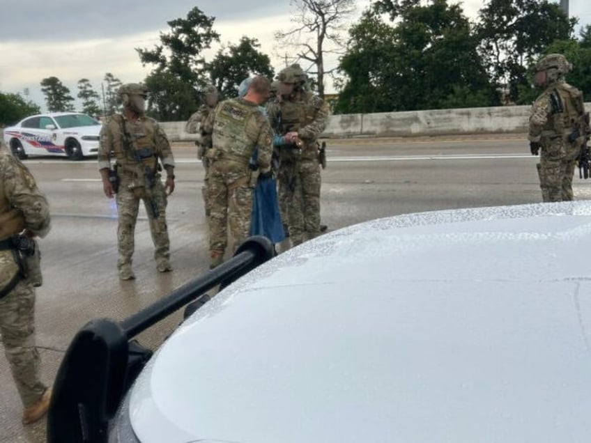 Woman with handgun on highway