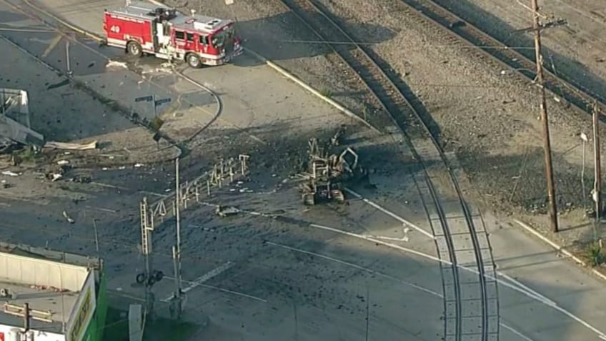 A firetruck next to the exploded truck