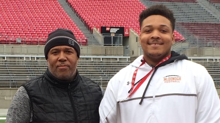 Jordan McNair poses with his father, Marty McNair