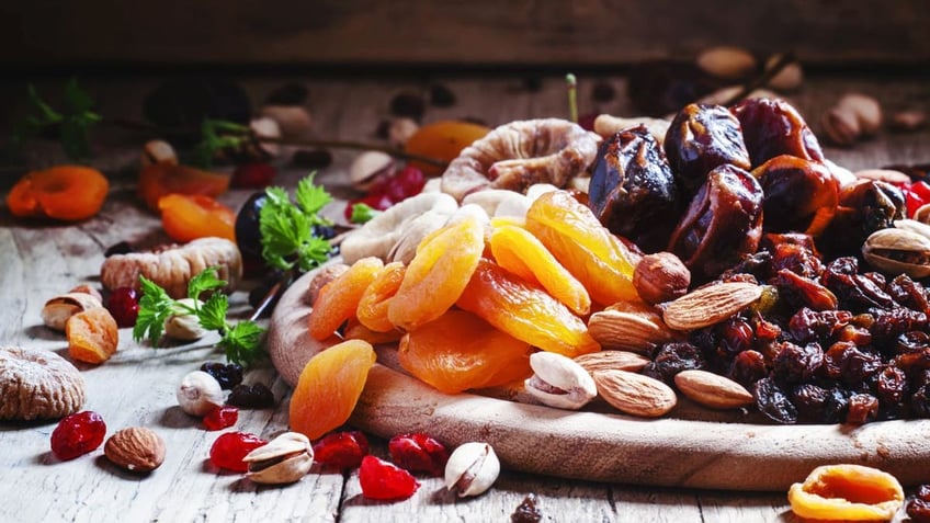 Plate of dried apricots, dates, raisins and nuts