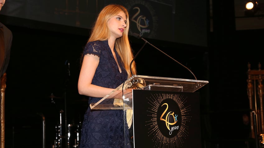 Alicia Alicia Kozakiewicz speaking at an event