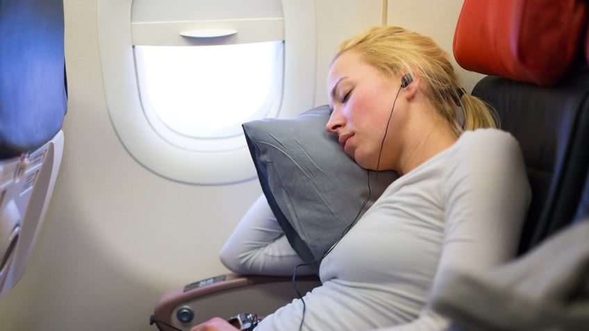 7 tips for falling asleep on long haul flights hint skip the alcohol coffee and sedatives