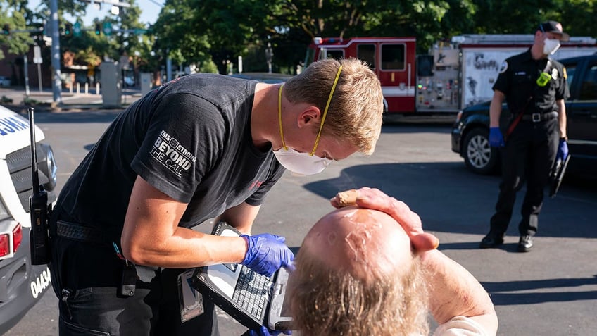 Man being treated for heat-related illness