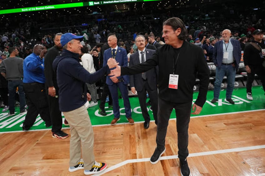 Josh Harris & David J. Adelman embrace after the game during Game 5 of the 2023 NBA Playoffs Eastern Conference semi-finals on May 9, 2023 at the TD...