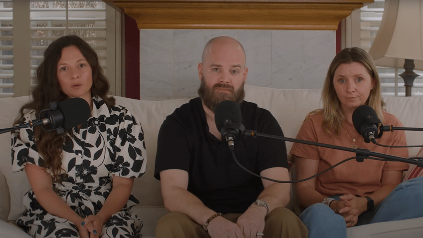 Mackenzie Rosman, Matt Gallagher and Beverley Mitchell sit on a couch in front of three podcast mikes