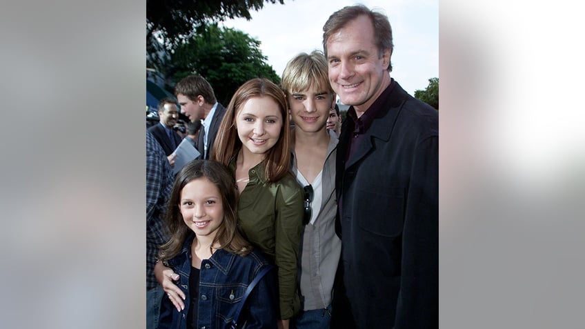 Mackenzie Rosman, Beverley Mitchell, Matt Gallagher and Stephen Collins' pose together for a photo at the 'Summer Catch' premiere in 2001