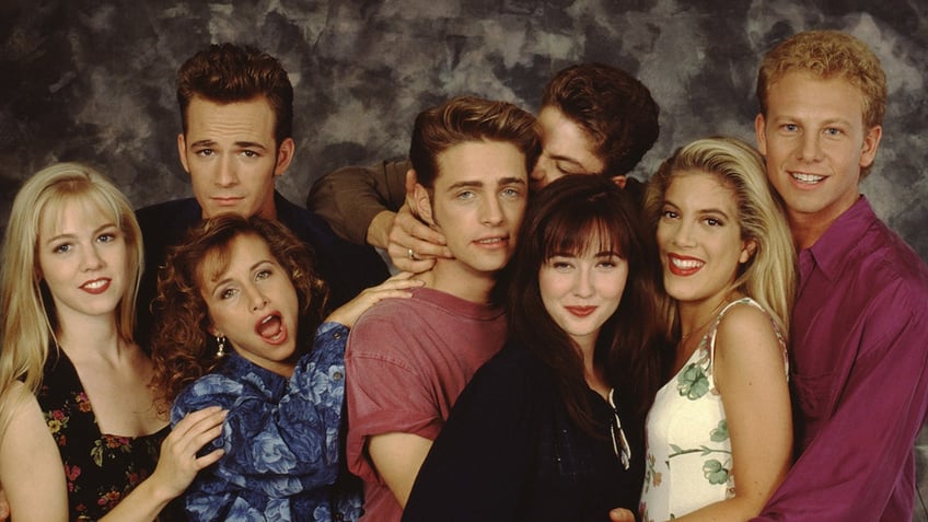 The cast of 90210 posing together for a promo photo