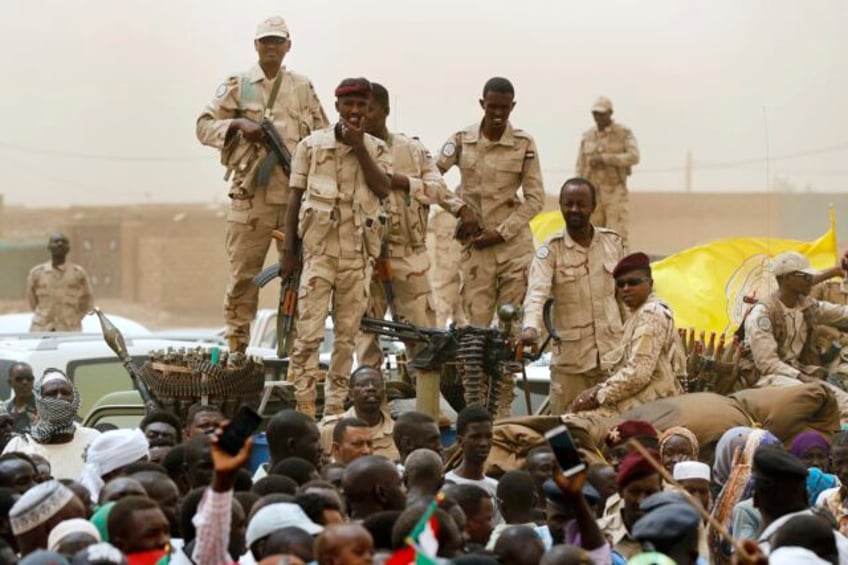 a drone attack on an open market has killed at least 43 people in sudan as rival troops battle