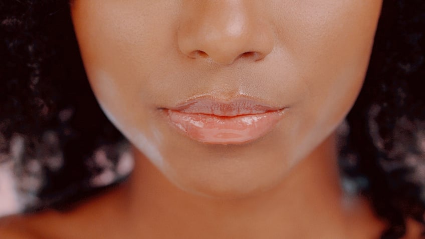 Woman with glossy lips