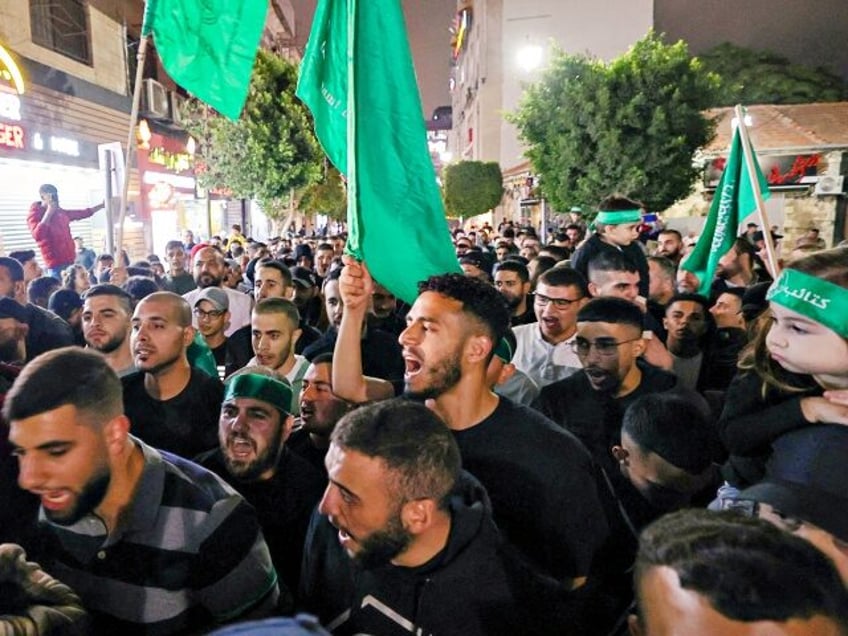 Palestinians gather in Ramallah in the occupied West Bank on October 10, 2023, to express their support for the Gaza Strip. Israel said it recaptured Gaza border areas from Hamas as the war's death toll passed 3,000 on October 10, the fourth day of gruelling fighting since the Islamists launched …