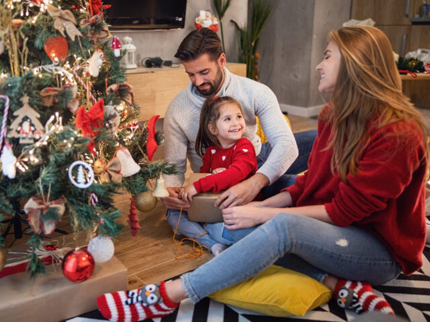 Family at Christmas tree