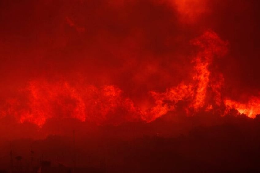 a major wildfire in northeastern greece has forced the evacuation of villages and a city hospital