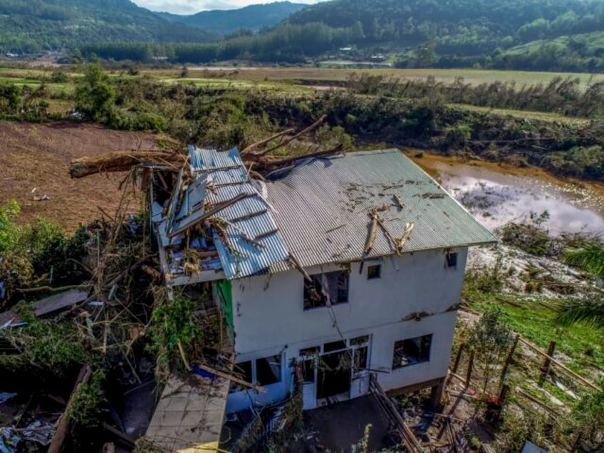 a storm in brazil leaves at least 27 dead and 1600 others homeless families are pleading for help