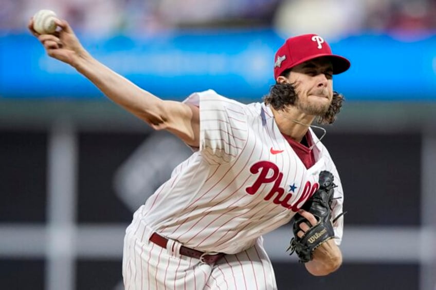 aaron nola returns to phillies on 7 year deal ap source says