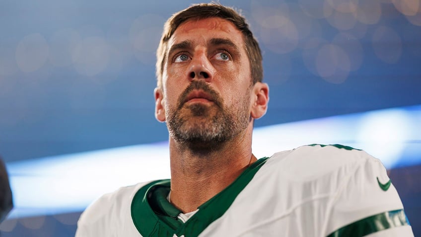 Aaron Rodgers looks on