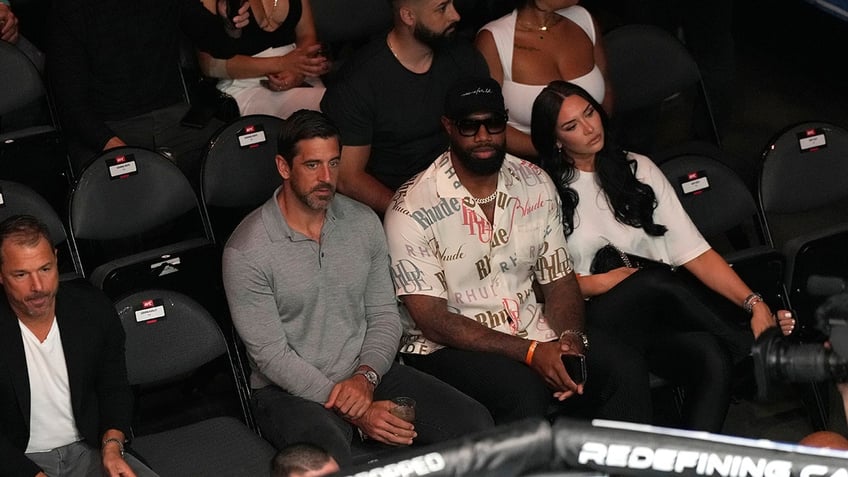 Aaron Rodgers with Mercedes Lewis