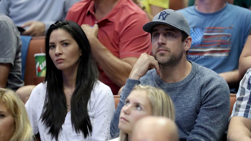 Olivia Munn and Aaron Rodgers in crowd