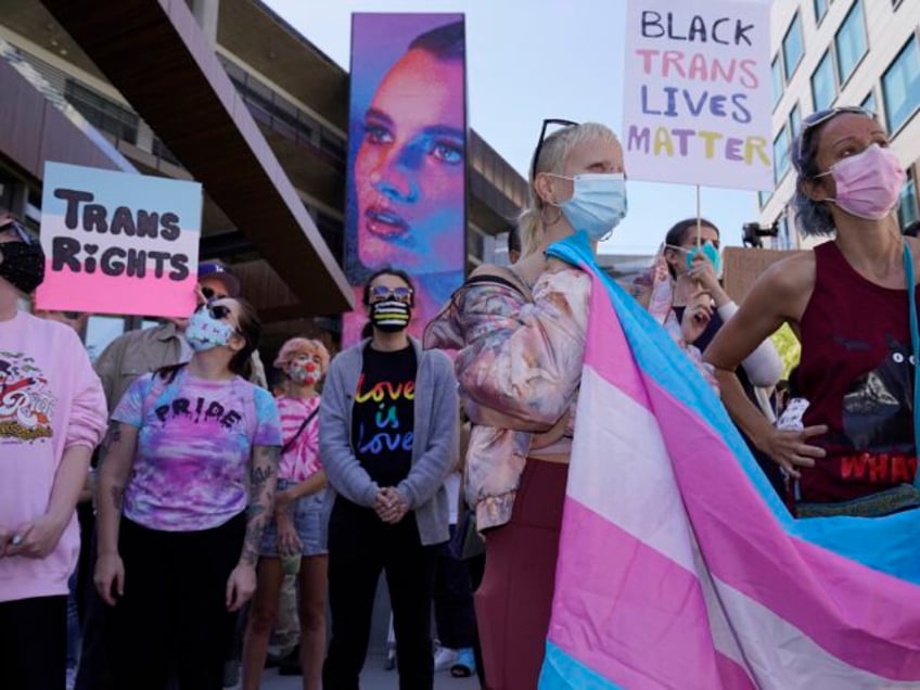 People protest outside the Netflix building on Vine Street in the Hollywood section of Los