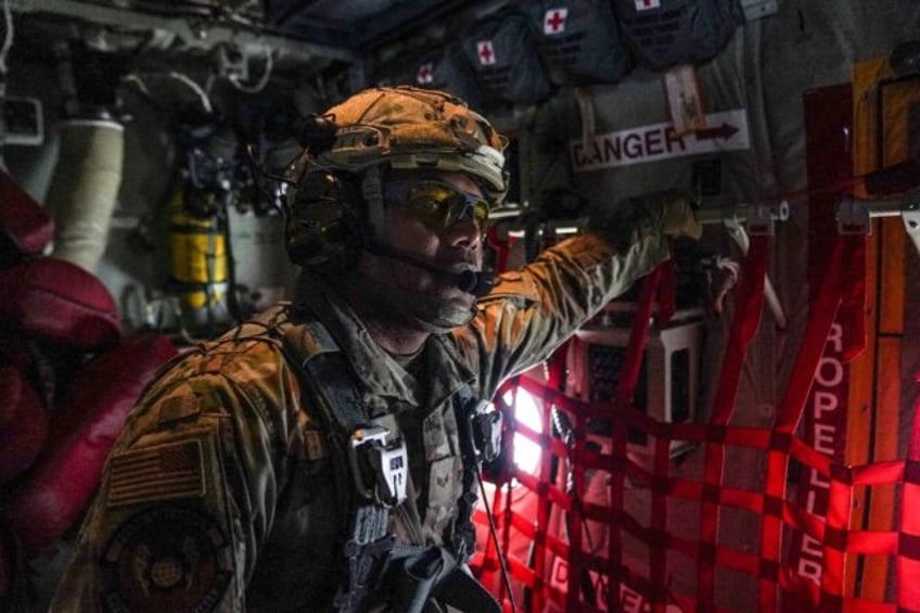 A member of the US Air Force 26th Expeditionary Rescue Squadron aboard an HC-130J aircraft