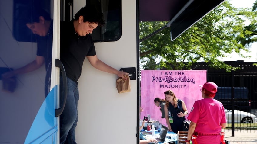 Marcus Aguinaga exits the Planned Parenthood Mobile Health Clinic after getting a vasectomy.