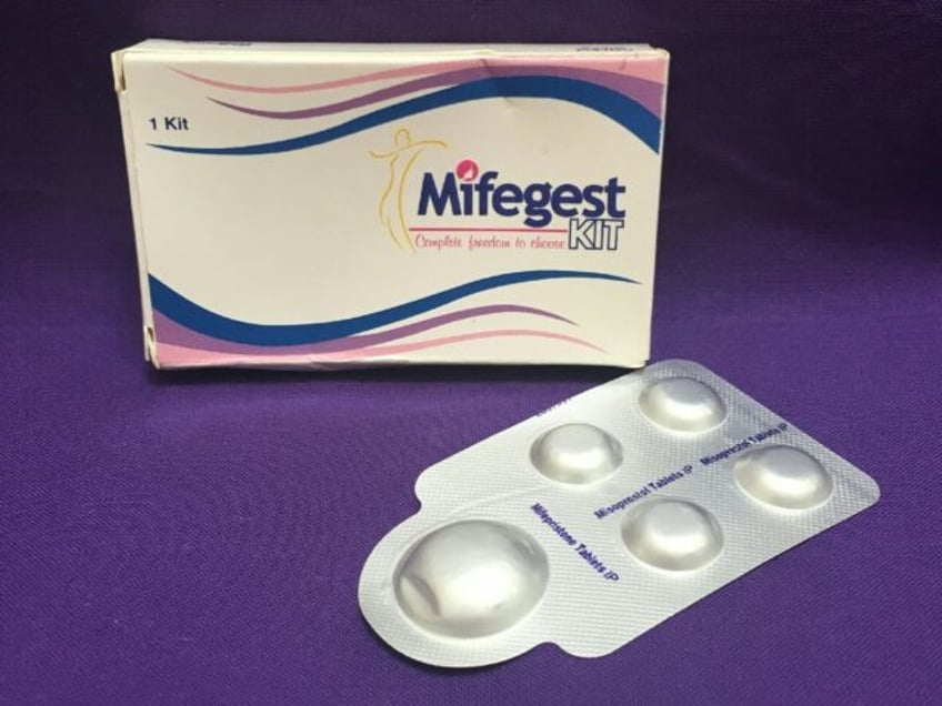 In this file photo taken on May 8, 2020 courtesy of Plan C shows a combination pack of mifepristone (L) and misoprostol tablets, two medicines used together, also called the abortion pill