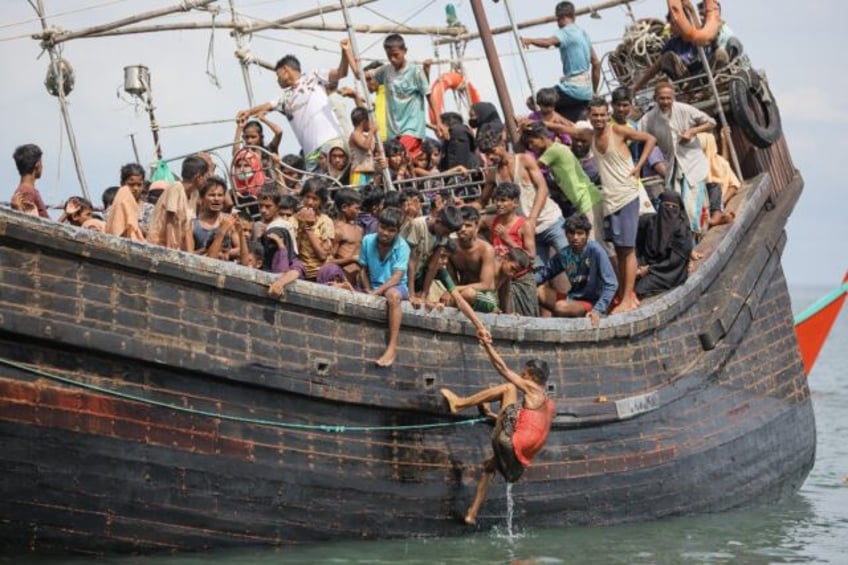 about 250 rohingya refugees reach indonesias west on decrepit boat