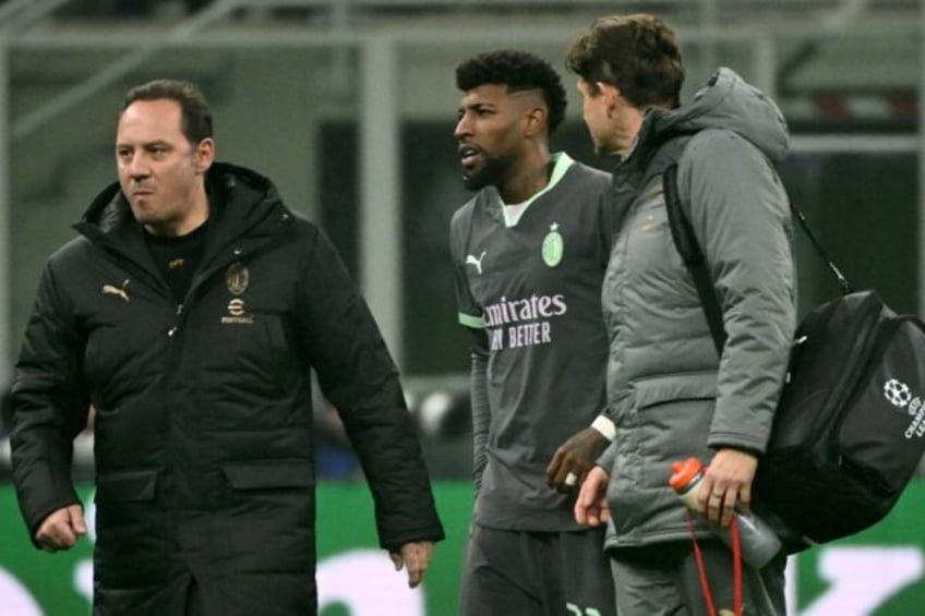 AC Milan's Brazilian defender Emerson Royal left the pitch injured during the UEFA Champio