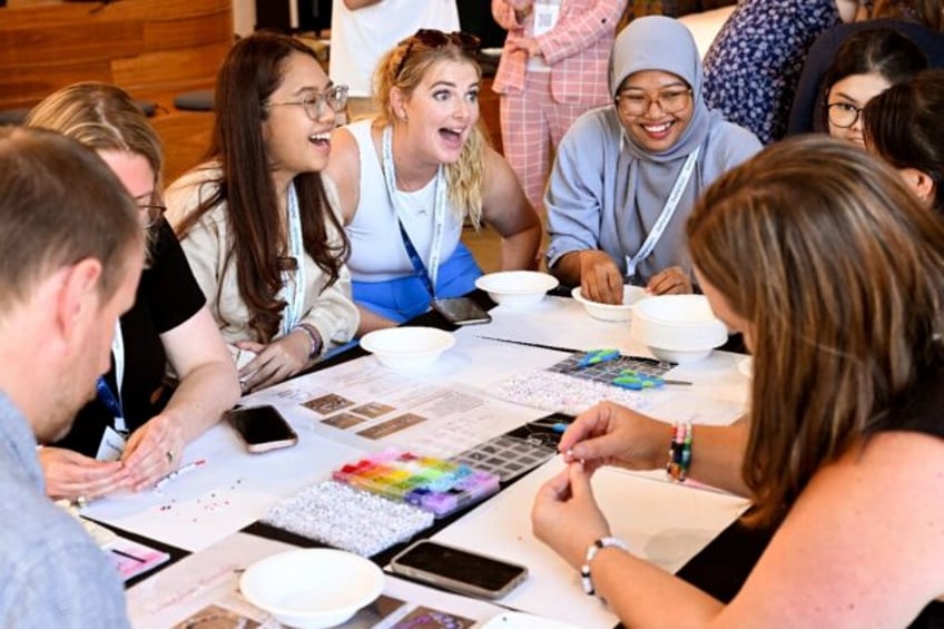 Academic Jasmine Gray takes part in a bracelet-making event during the University of Melbo