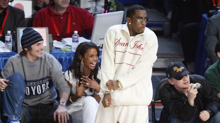 Ashton Kutcher, Kim Porter, Diddy and Leonardo DiCaprio at the 2004 NBA All-Star Game