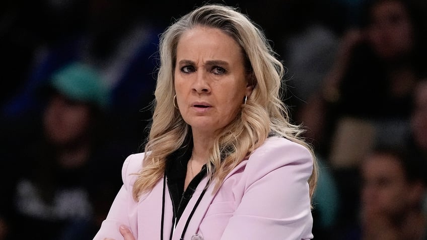 Becky Hammon looks on