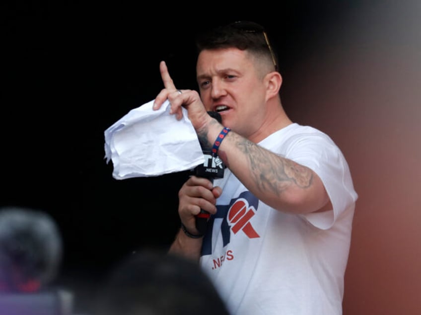 British far-right activist Tommy Robinson speaks during a rally in Parliament Square after