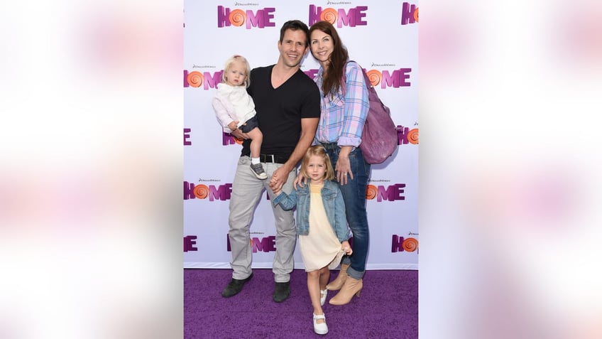 Christian Oliver, his then-wife Jessica and their children on a red carpet