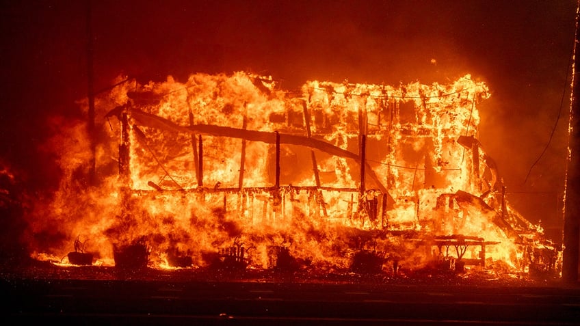 A structure burns during the Palisades Fire in the Pacific Palisades neighborhood of Los Angeles, California, US, on Tuesday, Jan. 7, 2025. Uncontrolled wildfires tore through parts of the Los Angeles region, fanned by extreme winds, forcing thousands of residents to flee and grounding firefighting aircraft. Photographer: Kyle Grillot/Bloomberg via Getty Images